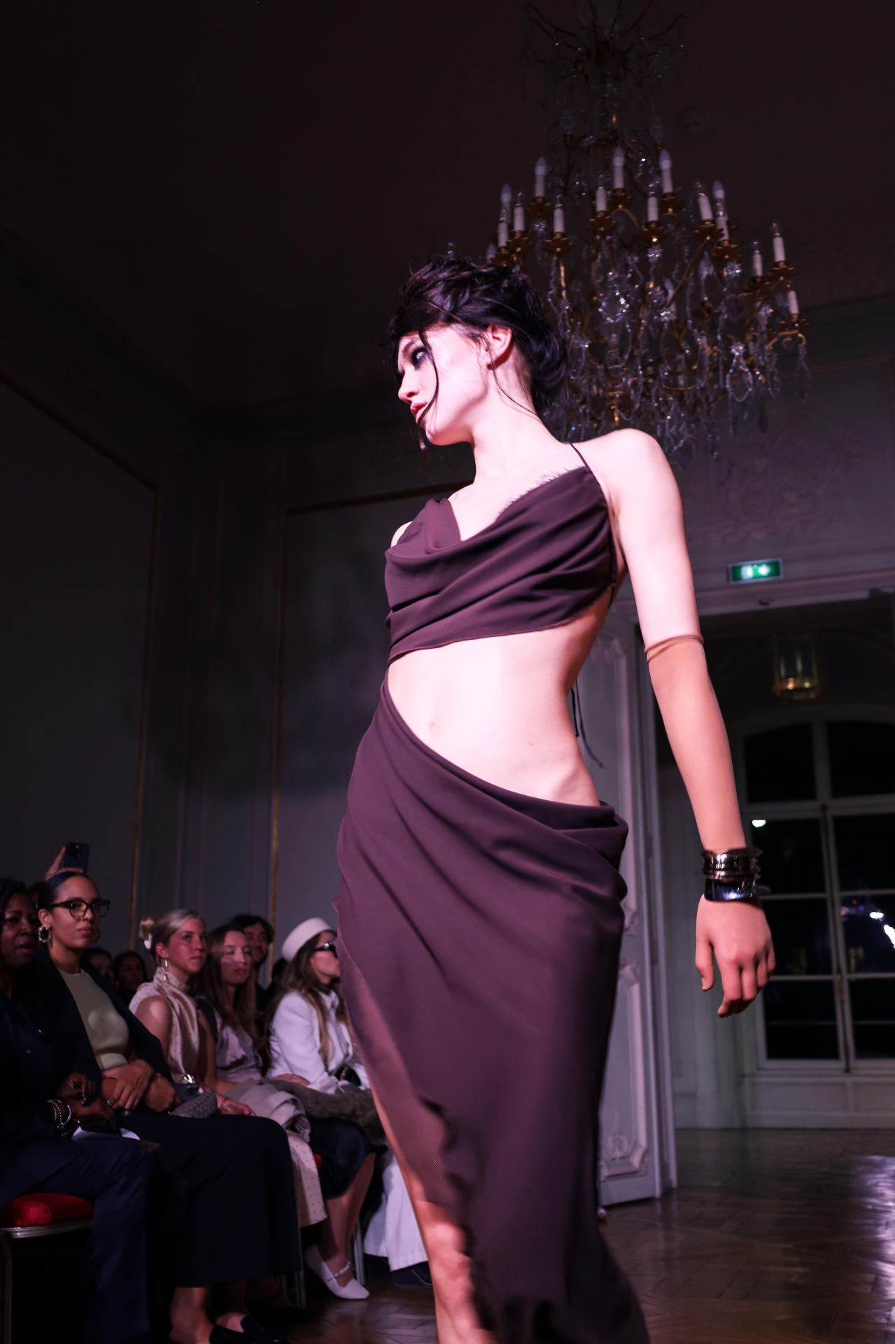 Mauve draped couture under candlelit chandelier