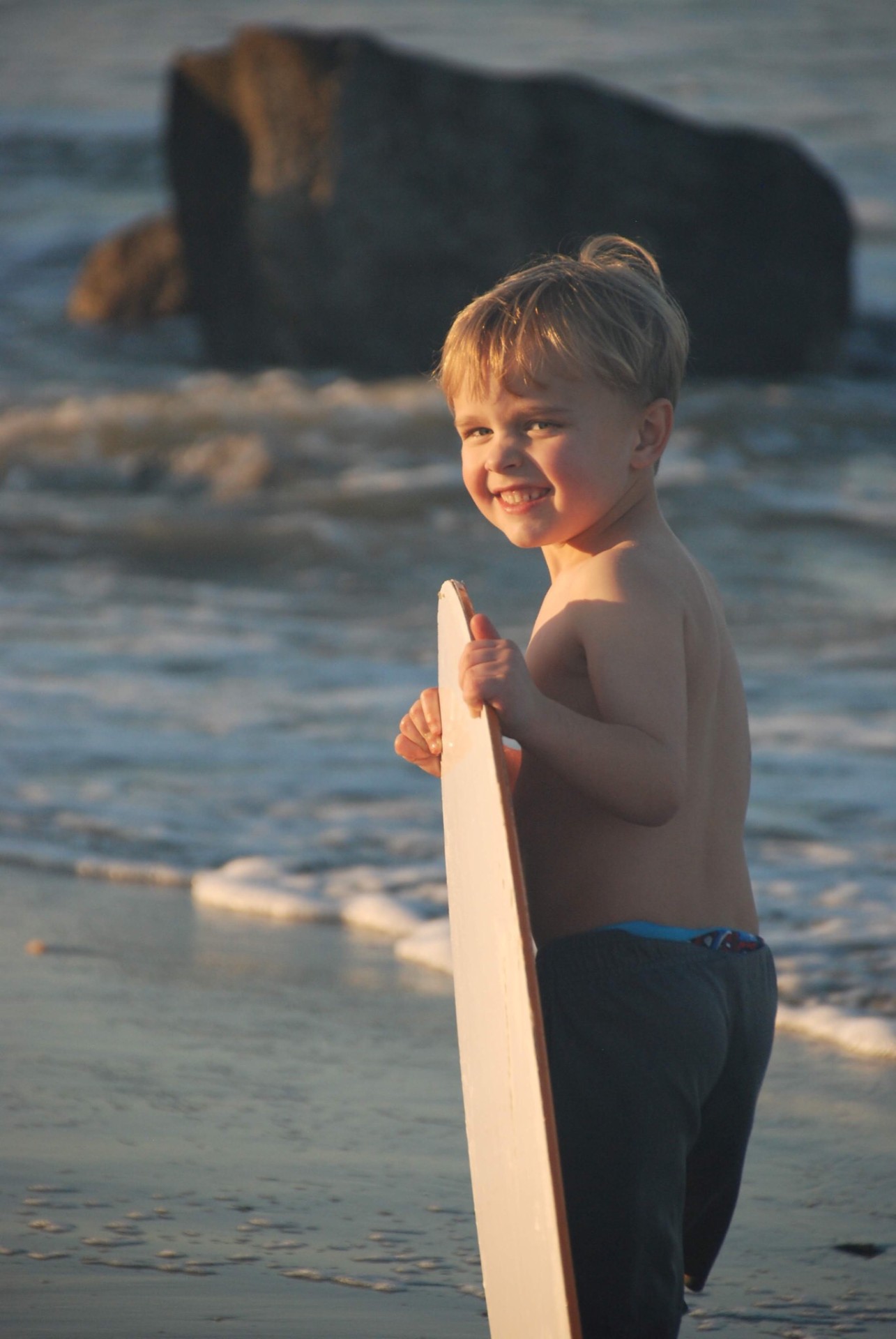 Candid beach portrait with skim board