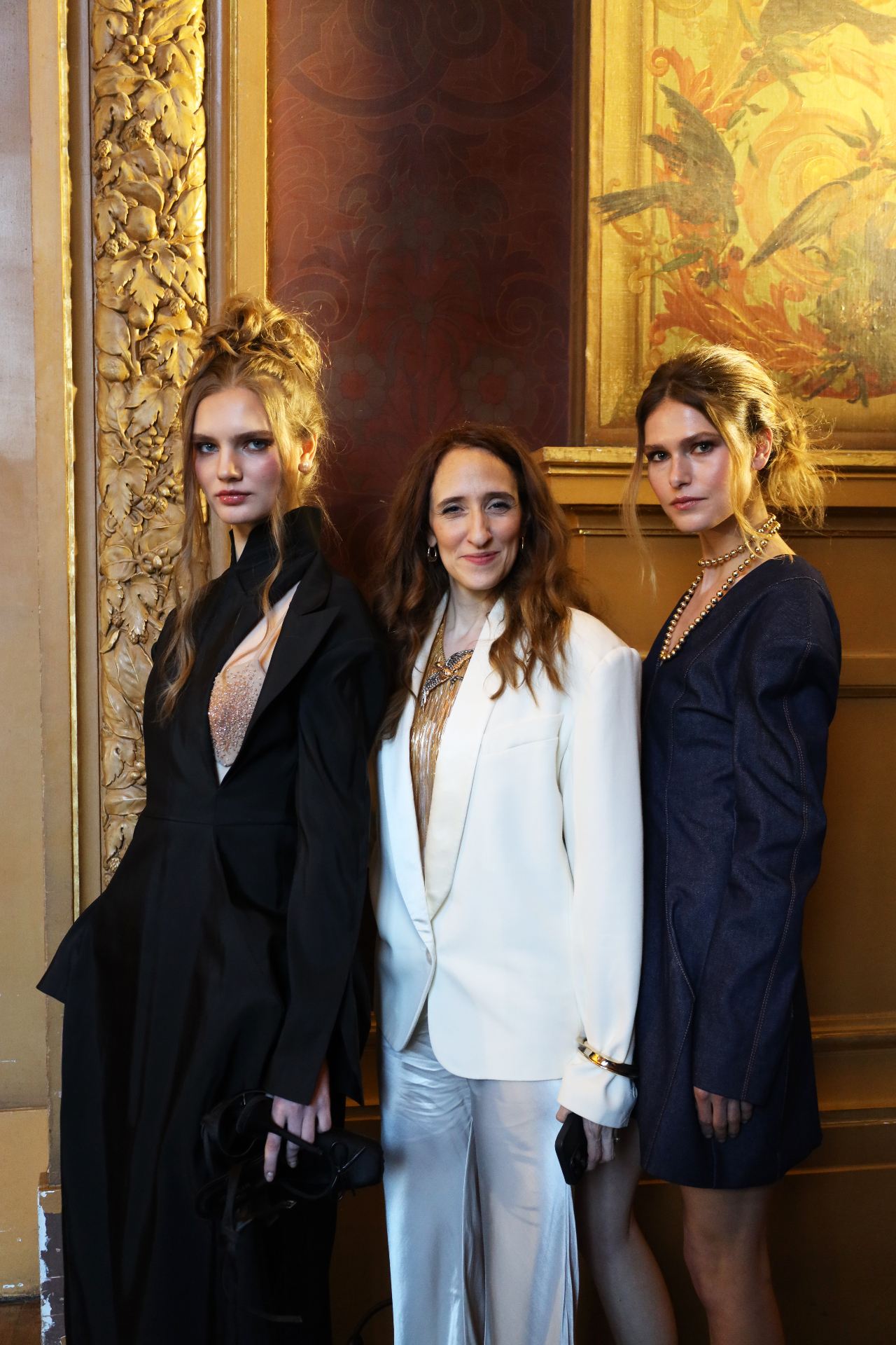 Designer portrait with models at the event