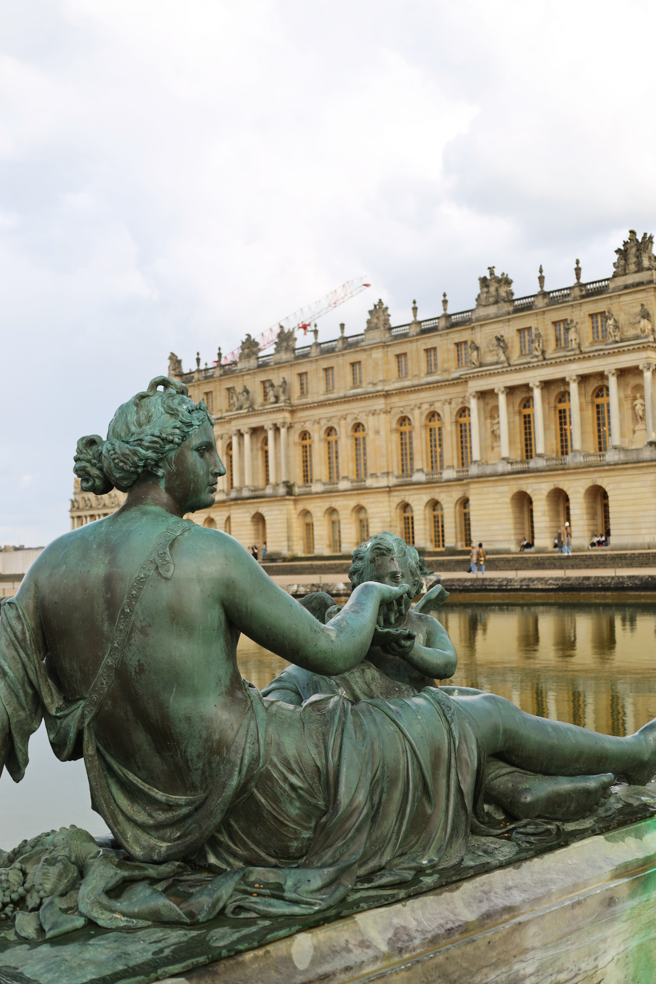 Bronze statue overlooking the Palace of Versailles