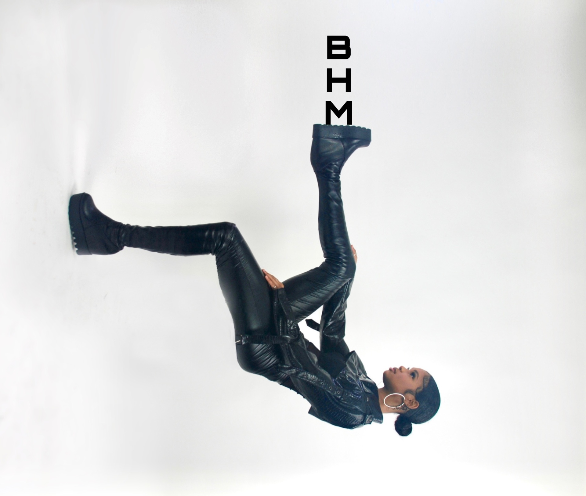 Studio motion portrait in black leather with BHM graphic