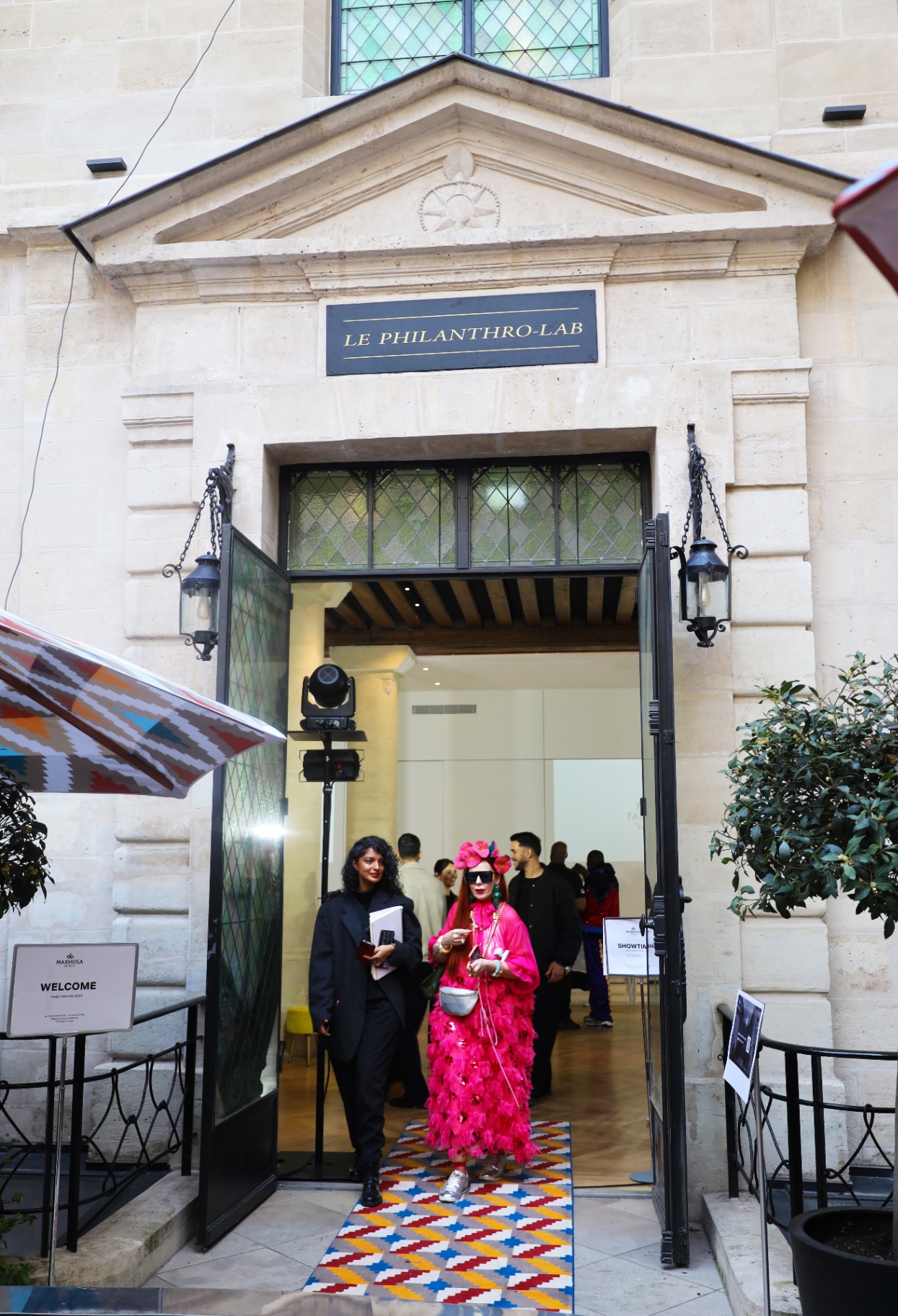 Bold pink feathered look at the Le Philanthro-Lab entrance