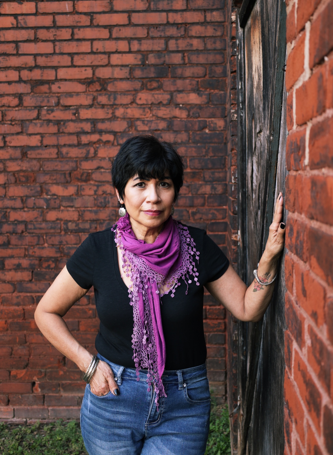 Portrait leaning against a brick wall