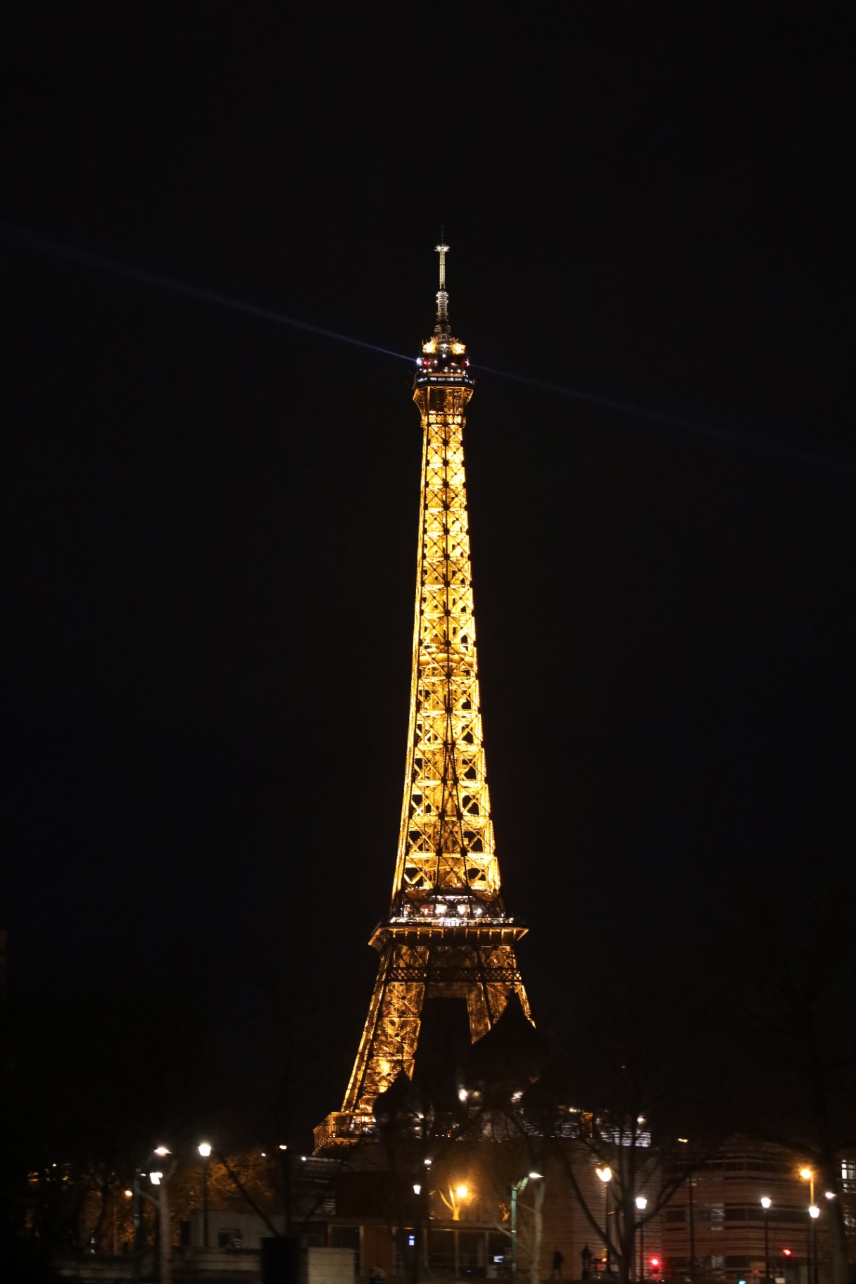Eiffel Tower glowing against the Paris night sky